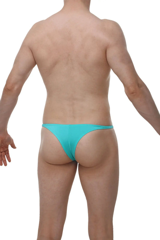 A sleek turquoise men’s thong made of smooth fabric with a minimalist design from petitq underwear by arthus and nicobikini
