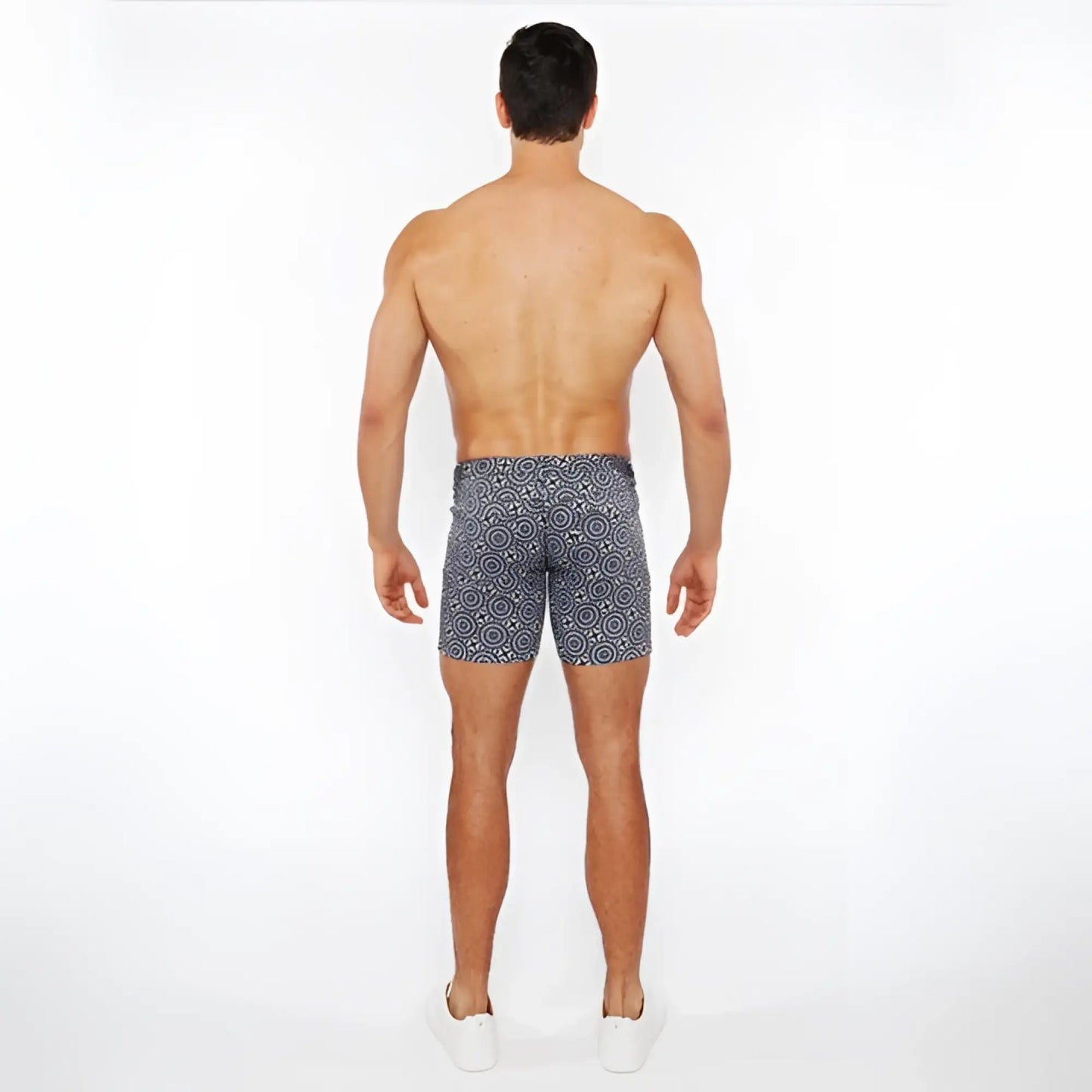 Men’s navy blue printed stretch knit swim trunks with white geometric pattern for comfortable water use