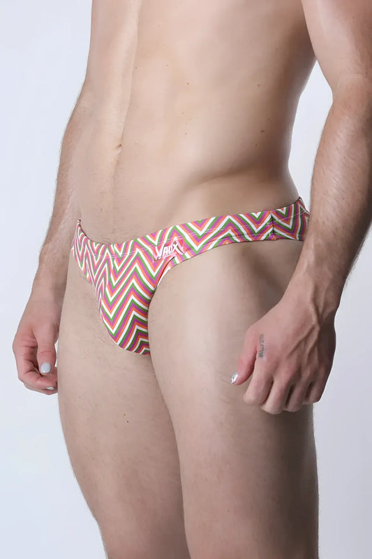 Vaux pulse swim brief featuring bold red green and white zigzag patterned men’s swim trunks