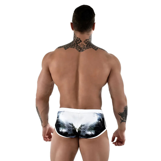 White swim trunks with black and gray palm tree print by Roberto Lucca in size 2XL for beach and pool use
