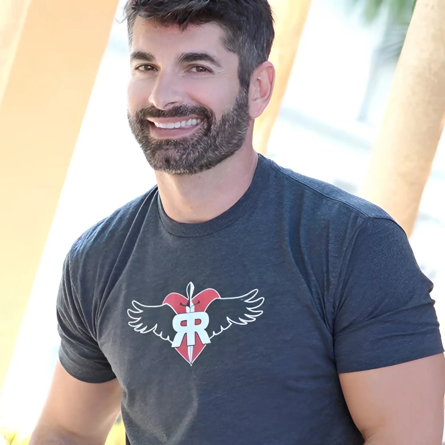 Dark heather gray short-sleeved ruff riders commitment t shirt with red heart white wings and r emblem size large