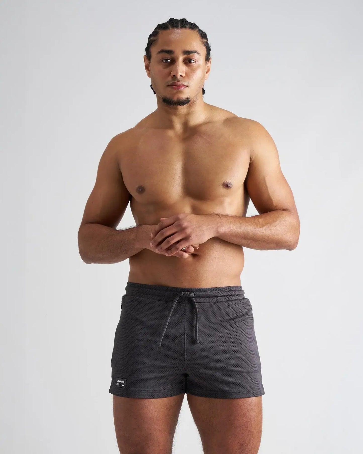 Dark gray s.s.c. fraternity 3 mesh shorts with drawstring waistband textured fabric and small brand tag on lower left leg