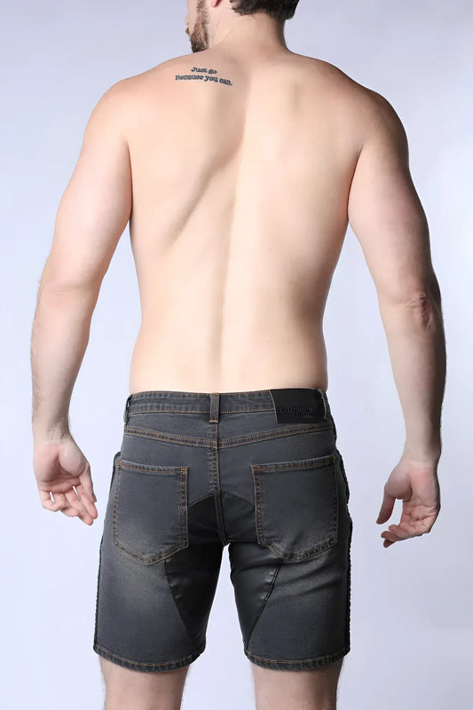 Dark gray denim shorts with a black leather Saddleback denim short brand patch on the waistband back side view