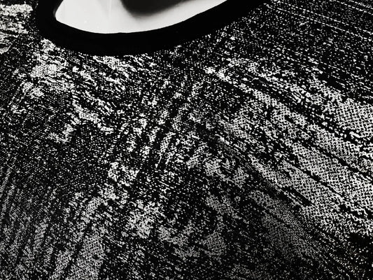 Black lace silver leaf tee with intricate textured pattern showcasing detailed craftsmanship