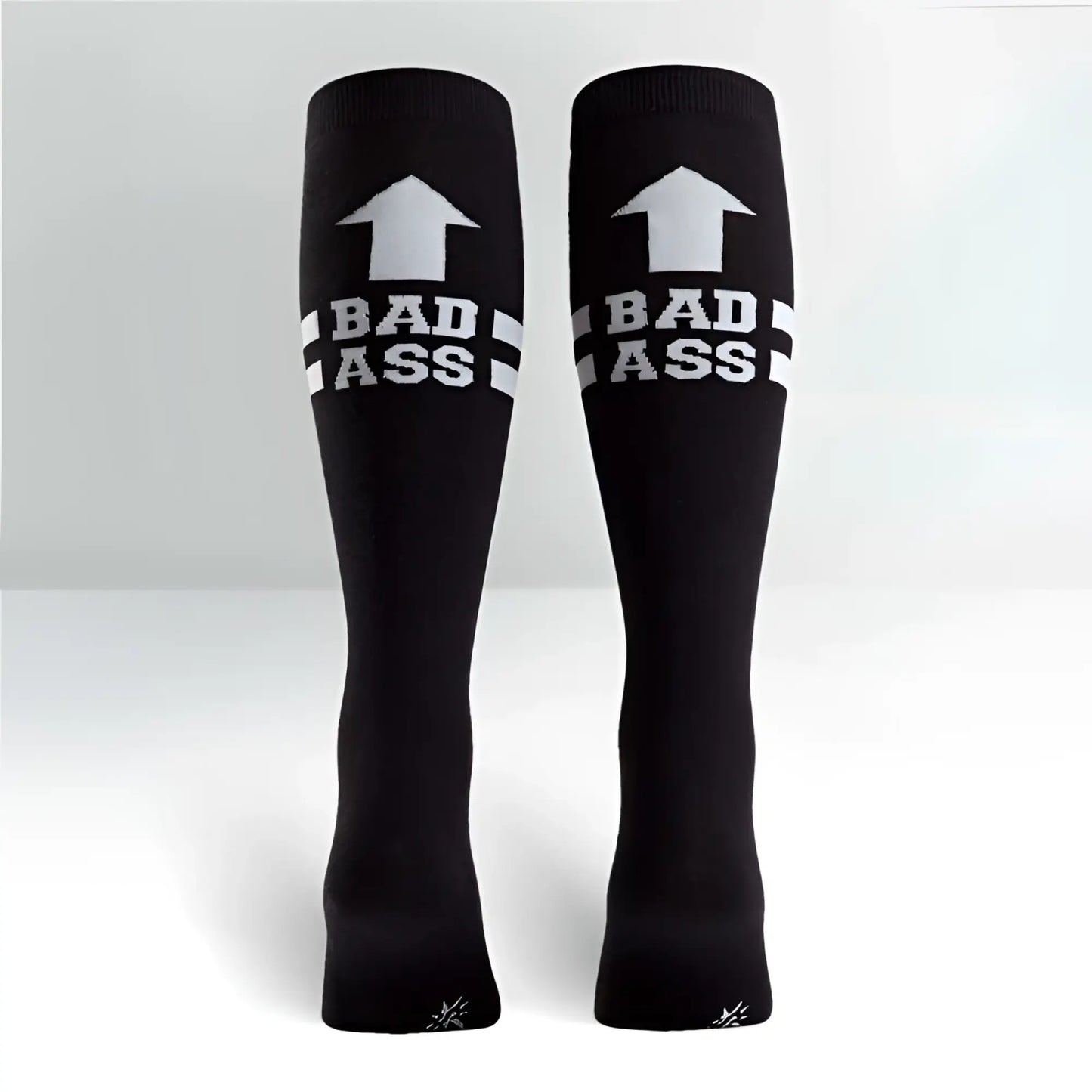 Black knee high socks by sock it to me with white upward arrow bad ass text and two horizontal stripes size m