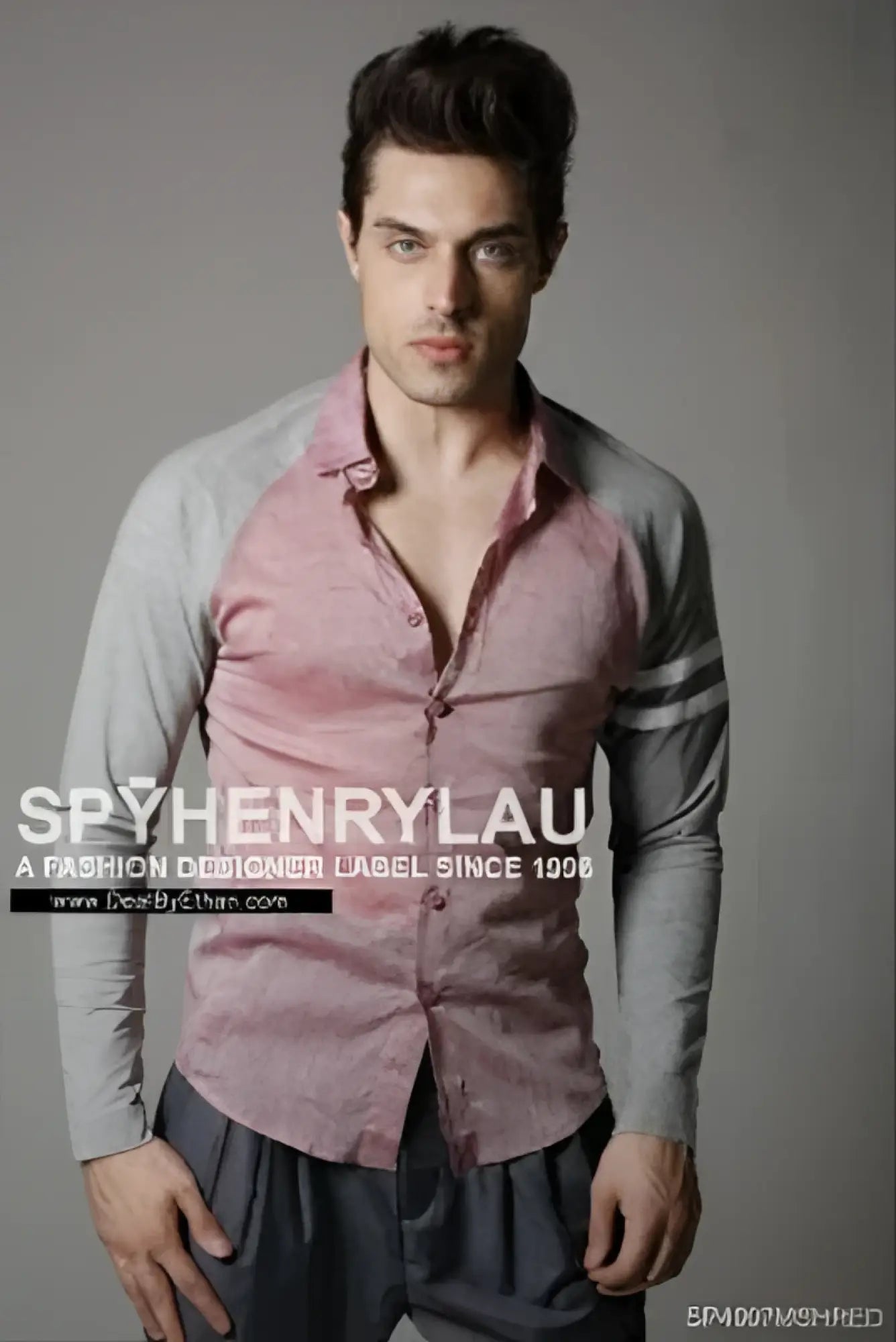 A man wearing a spy henry lau slim fit long sleeved button-up shirt with pink and gray contrast panels size L