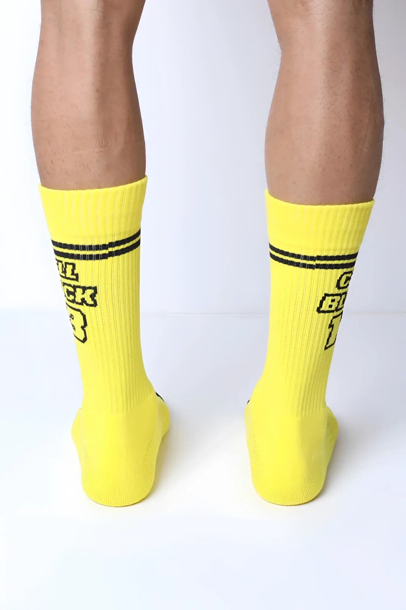 Starter crew socks in bright yellow with black text and two horizontal stripes near the top for casual wear