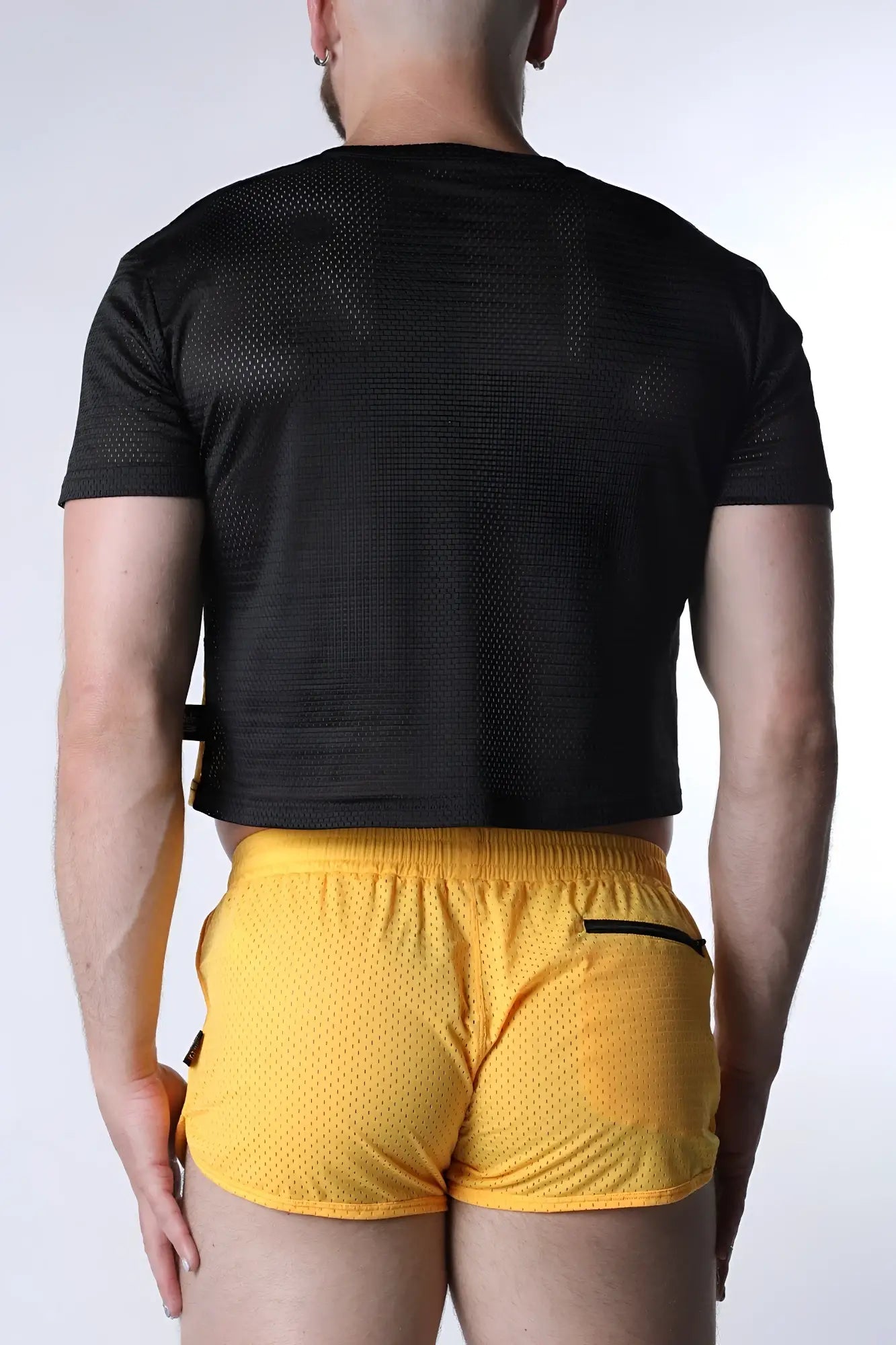 Starter mesh crop top black short-sleeved with subtle textured pattern and matching black side straps