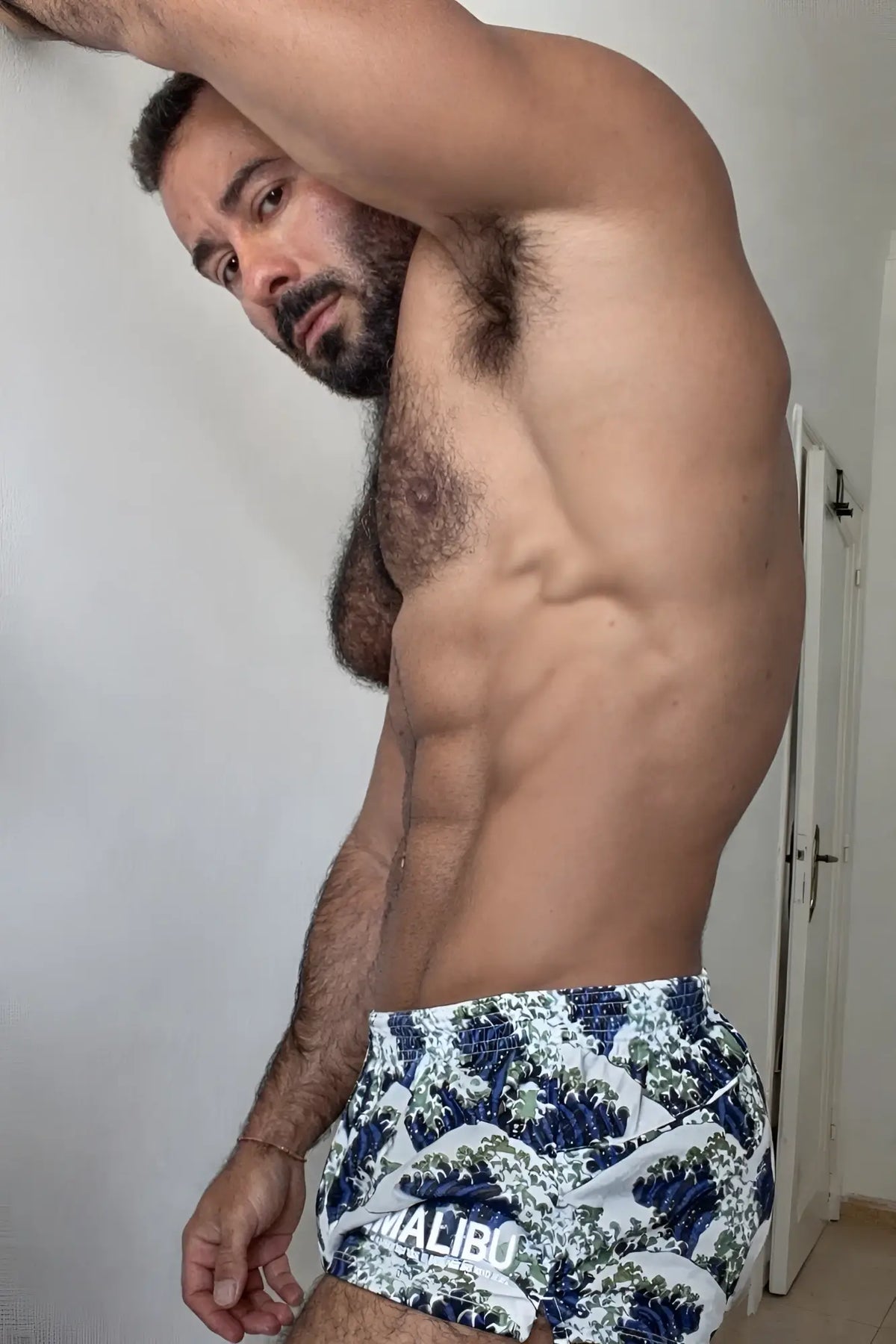 Blue and white stretch-it 2 inch athletic short shorts with wave pattern and malibu branding for active wear