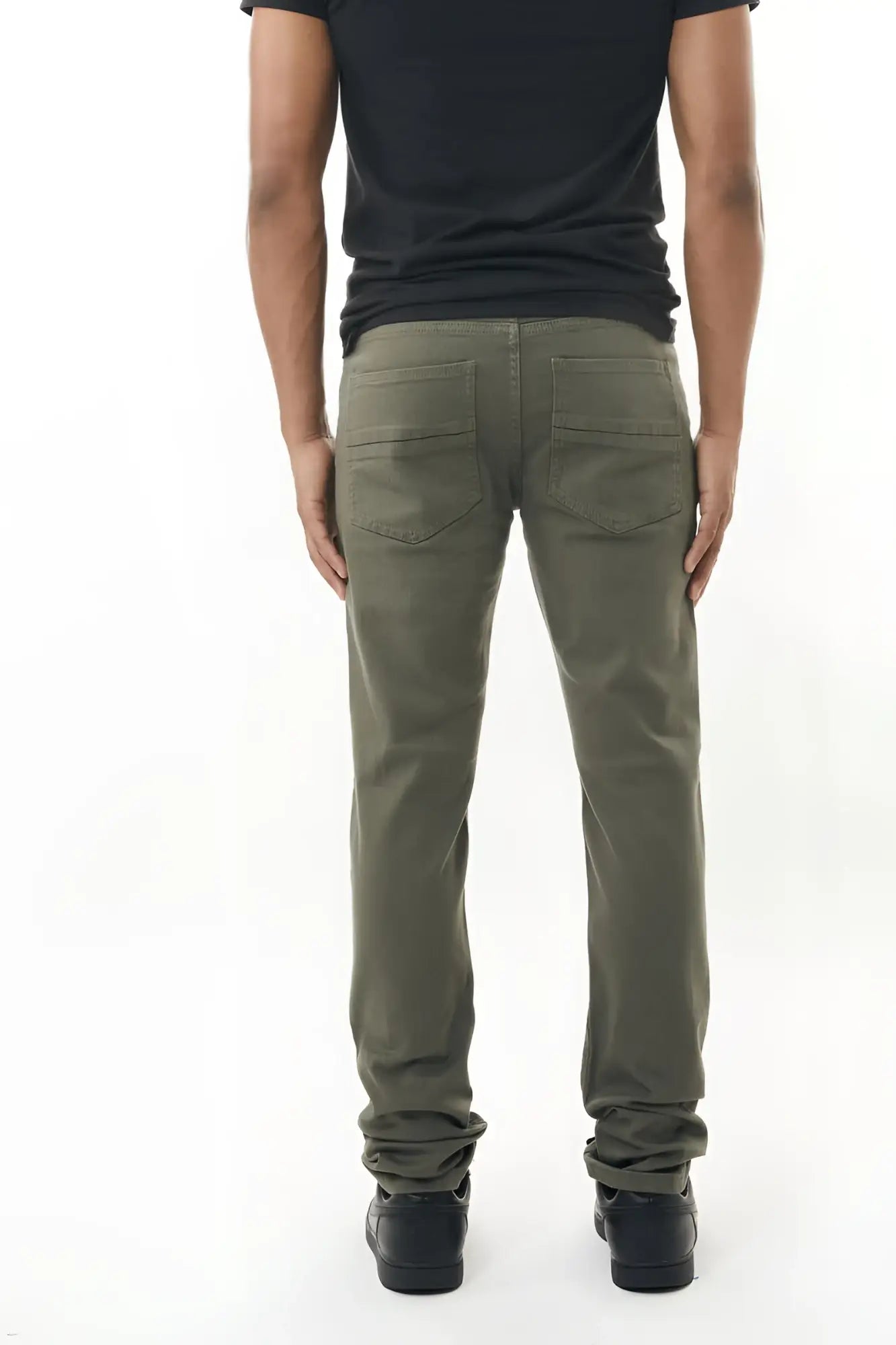 Olive green stretch twill pant with straight-leg fit rear pockets and rolled cuffs shown from the back side