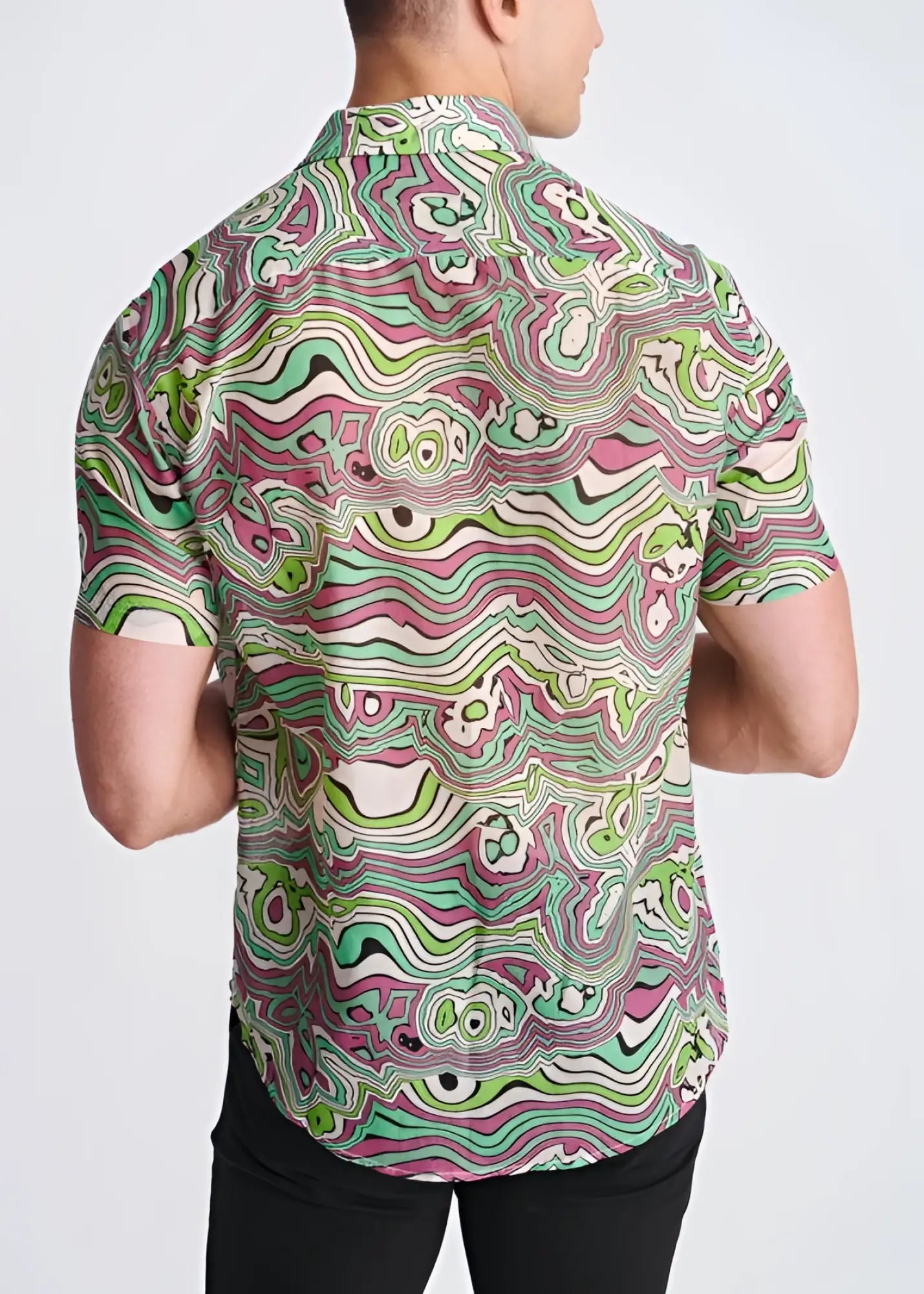 A vibrant short-sleeved lightweight cotton silk shirt with a psychedelic green pink and white swirling pattern