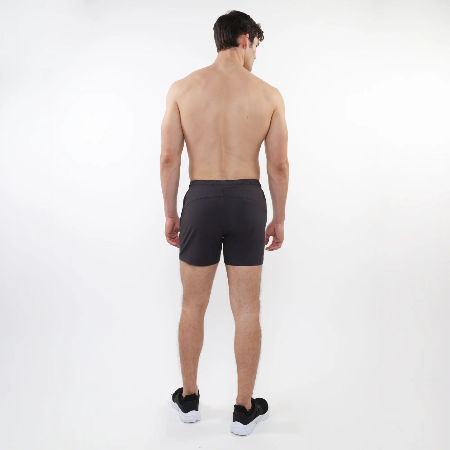 Black textured mesh stretch performance shorts with a sleek form-fitting design and subtle side pockets