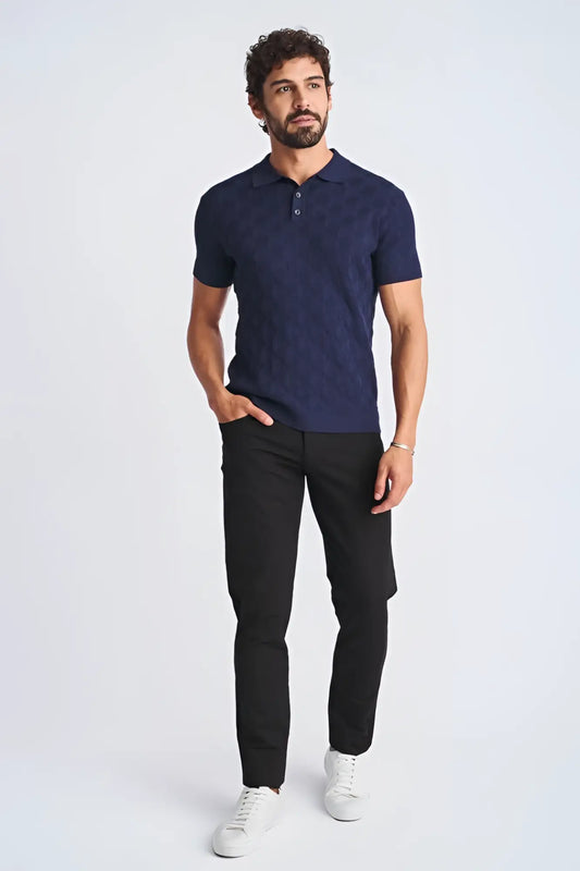 Navy blue short-sleeved polo shirt with textured stripes made of silk and tencel featuring a classic collar and buttoned placket