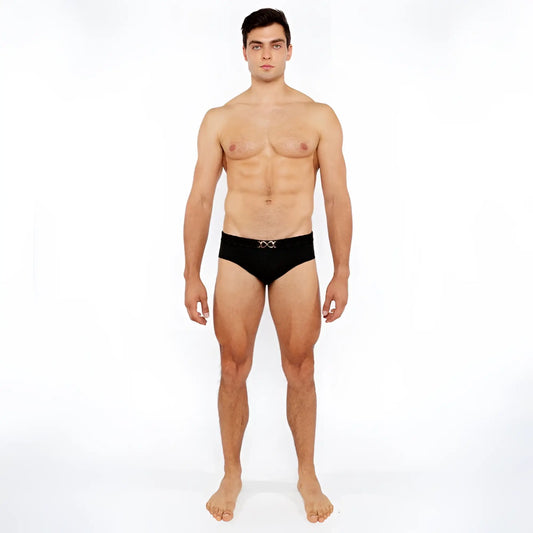 Black textured swim brief with front buckle and silver metallic x-shaped logo on waistband for swimming use