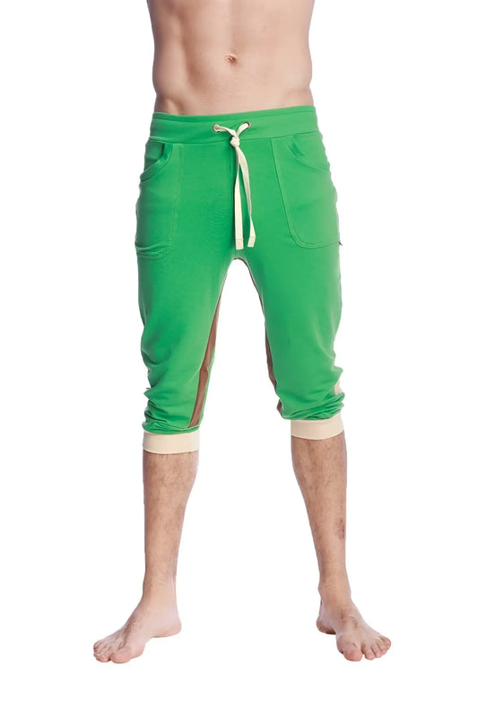 Green ultra-flex tri-color cuffed yoga pant with beige drawstring and matching cuffs in capri-length jogger style