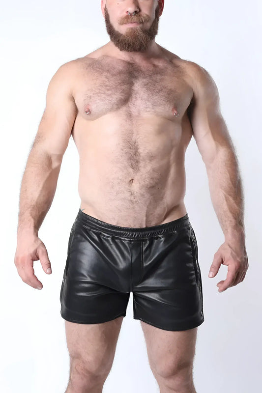 Black faux leather void snap up short with shiny smooth texture and side zippers for edgy style