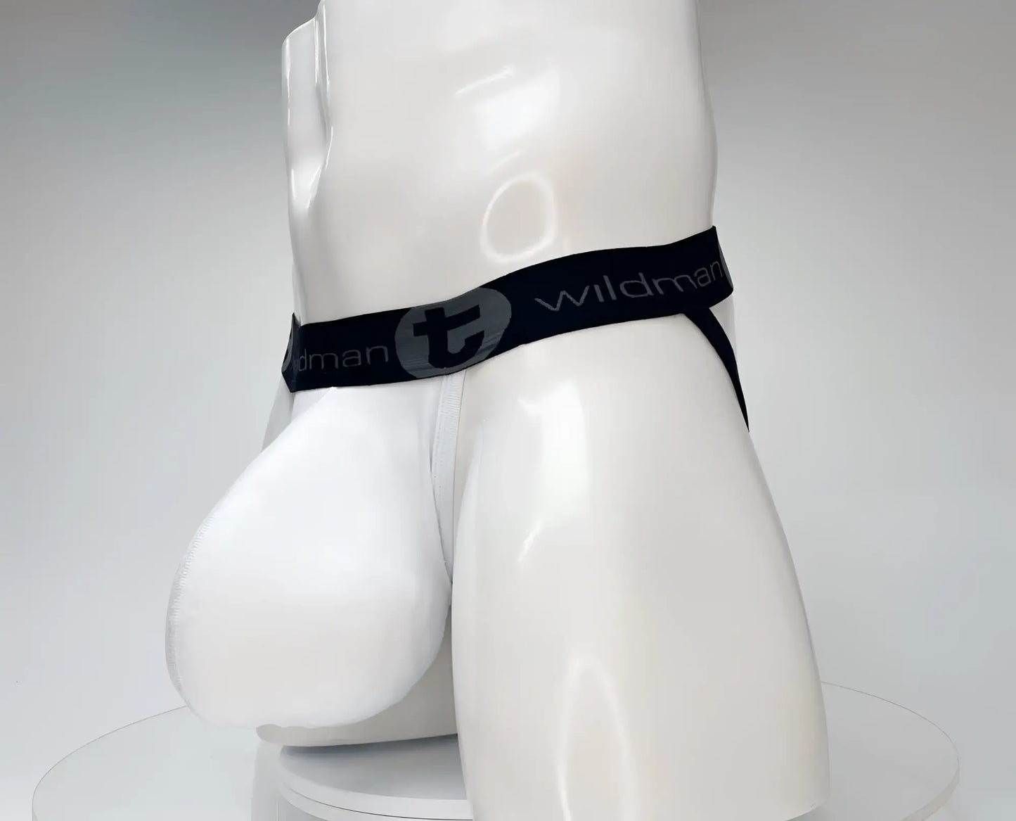 White wildman cotton briefs with black elastic waistband featuring gray wildman logo from wildmant cotton monster cock jockstrap white