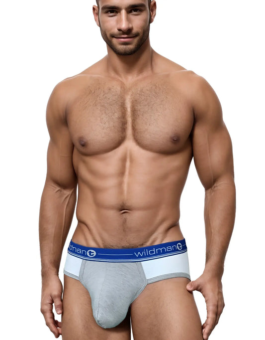 Athletic man wearing Duo Big Boy blue and grey pouch briefs with a branded elastic waistband.