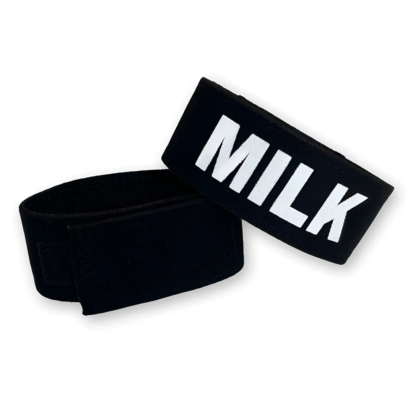 Black elastic wristband with bold white milk lettering featured in wildmant fetish max cock-ring-milk product