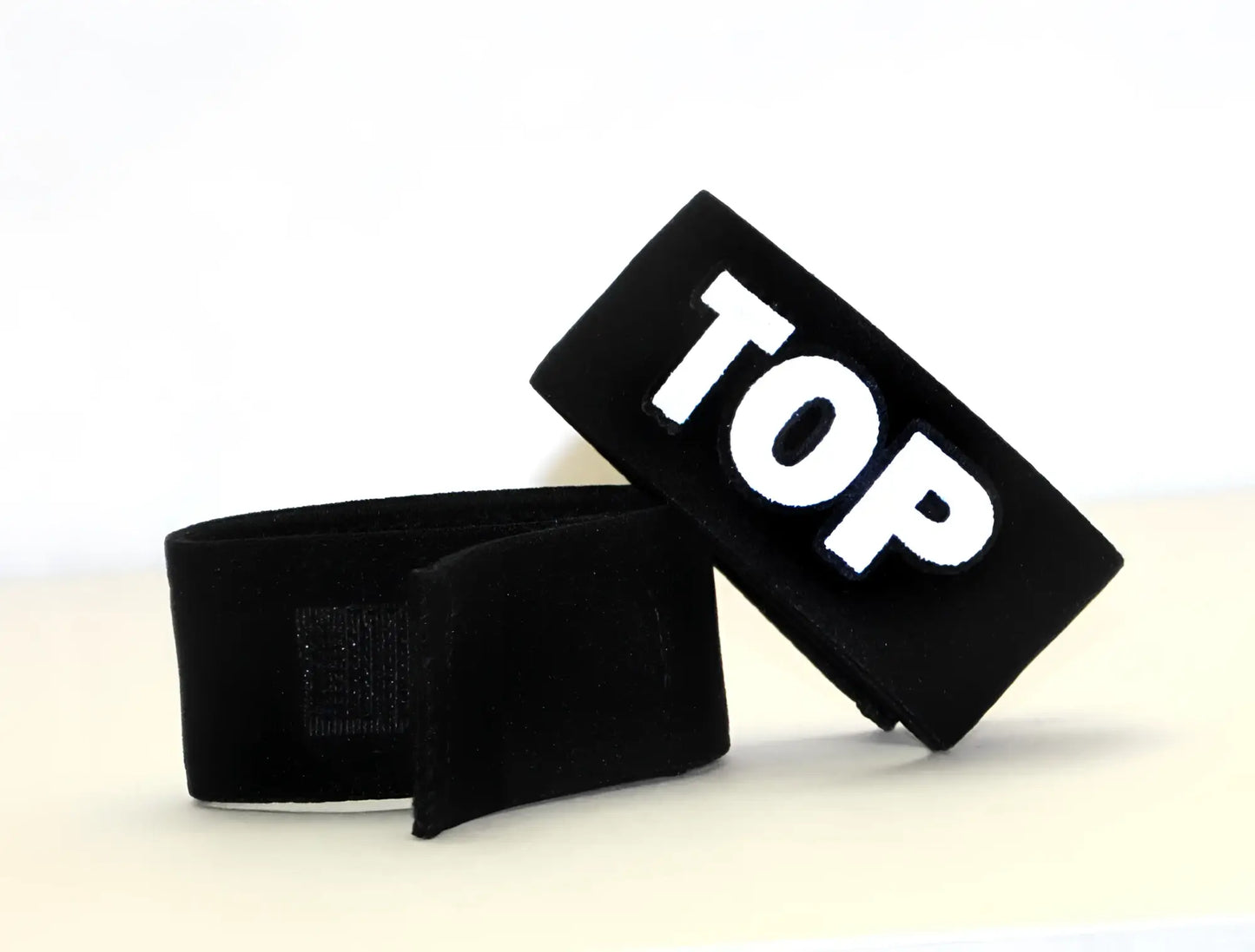 Black velour wristband with white embroidered top lettering for wildmant fetish max cock-ring-top accessory