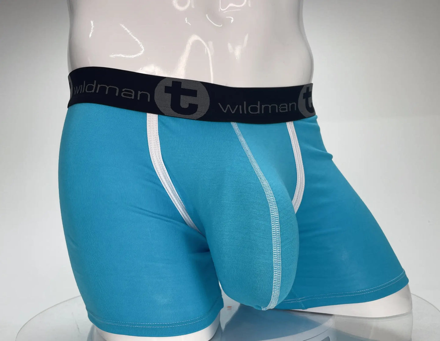 Blue wildman modal boxer briefs with white trim and black waistband featuring the brand logo in baby blue