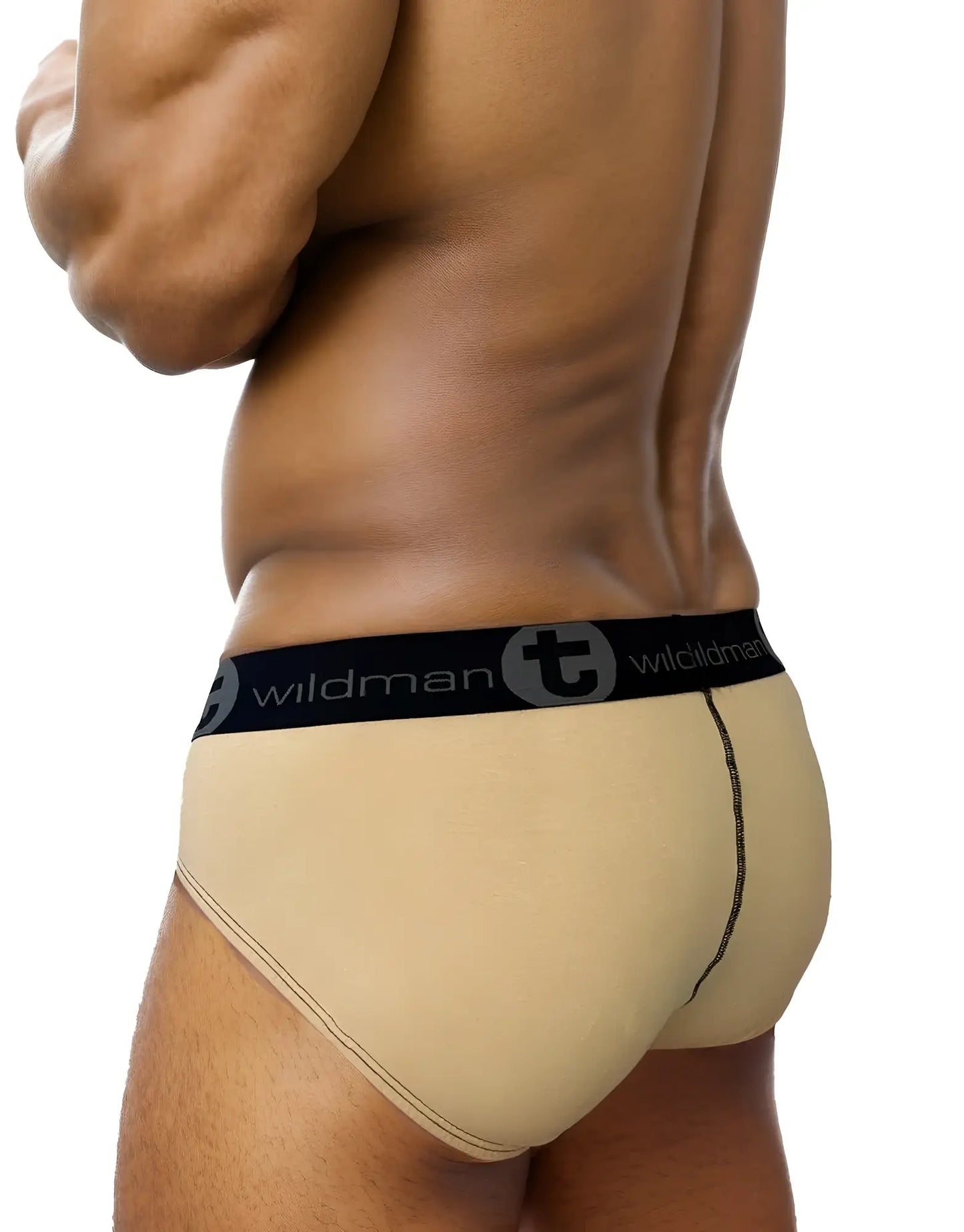 Beige wildmant monster cock cotton brief with black elastic waistband and stylized t emblem in stripe tan