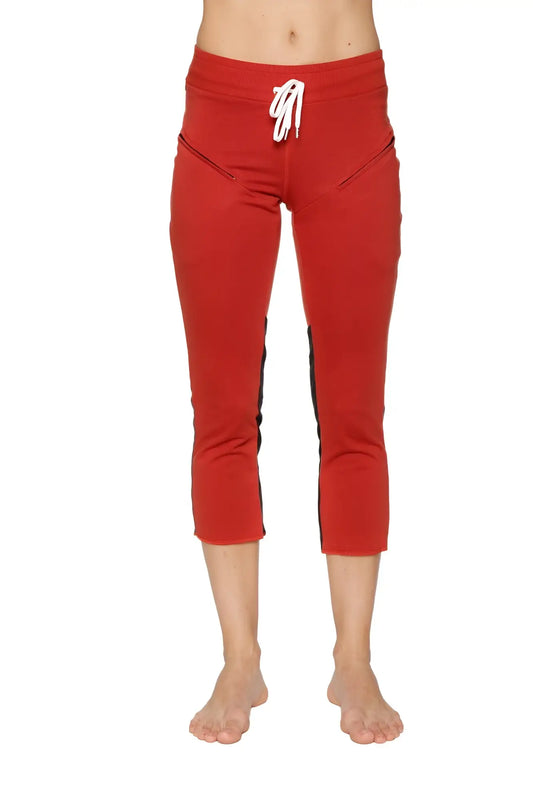 Women’s cinnabar capri yoga pants with black side stripes white drawstring waistband and zipper pockets