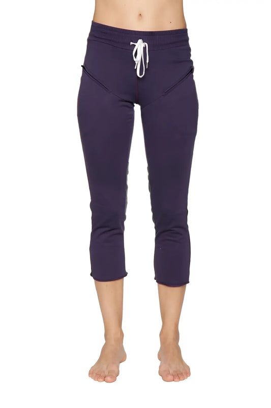 Women’s navy blue capri-length yoga pants with white drawstring waistband and side pockets for activewear