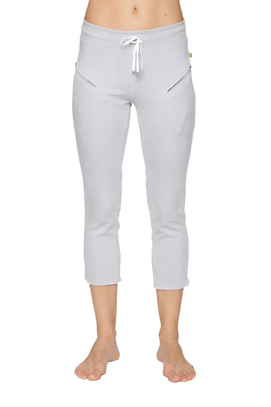 Light gray women’s 4/5 length capri yoga pants with white drawstring waistband and diagonal zipper pockets