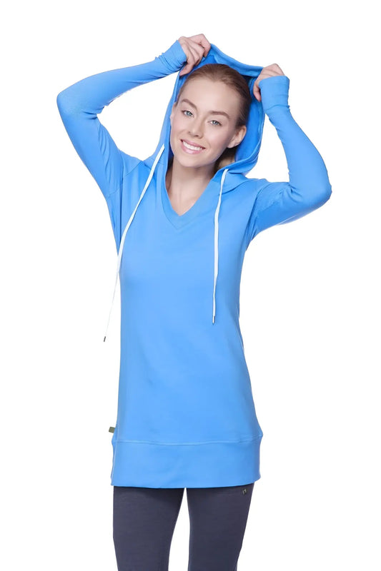 Women’s long body hoodie top in vibrant ice blue with royal blue v-neck and white drawstrings with long sleeves