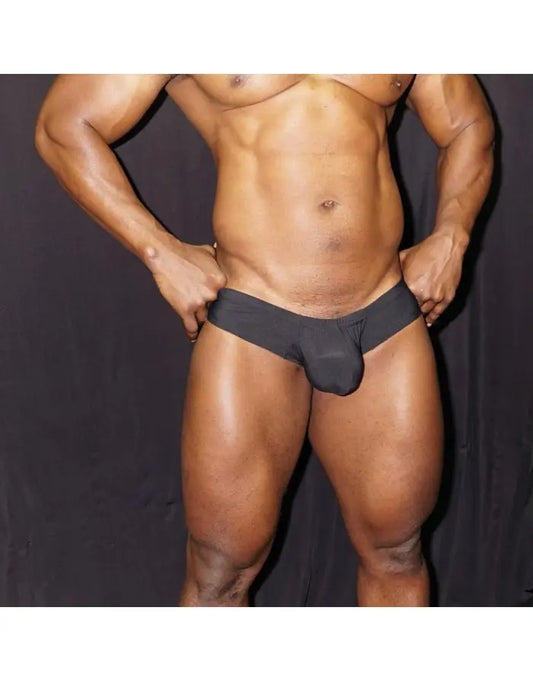 Black men's boxer underwear by Arroyman featuring a snug fit and soft fabric shown on a model.