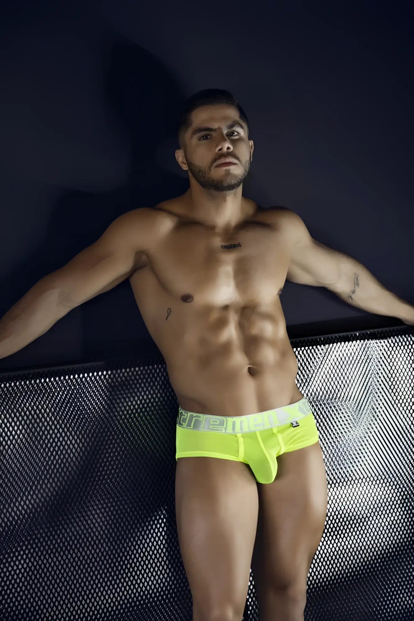 Bright neon yellow microfiber briefs with white elastic waistband and ere branding in black lettering