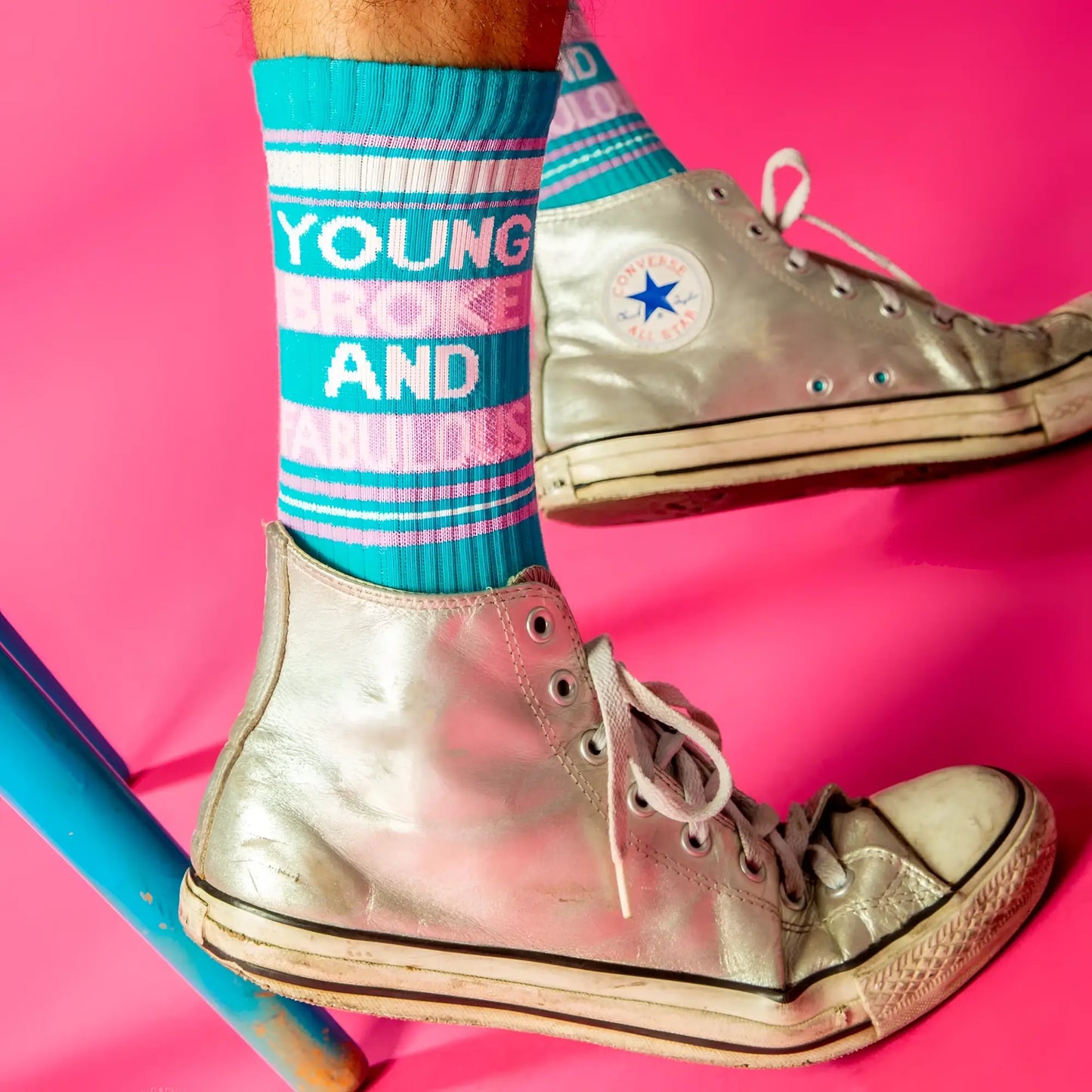 Silver high-top converse all stars with white laces and faded sole paired with young broke and fabulous crew socks