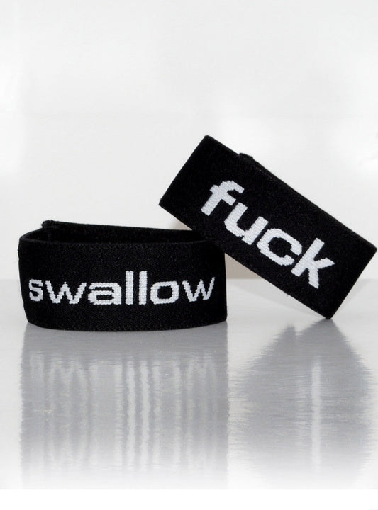 Black elastic wristband with white embroidered text fuck and swallow from wildmant verbal max cock ring fuck product