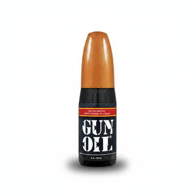 A sleek black gun oil bottle with a glossy orange cap labeled in bold white letters from gun oil personal lubricants