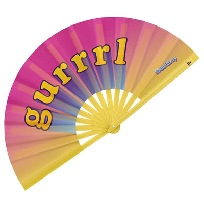 Open handheld fan with rainbow gradient fabric and the word gurrl printed.