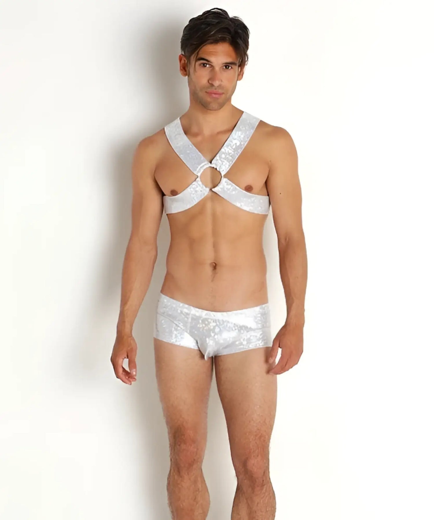 Man wearing Rick Majors silver metallic harness and trunks on white background
