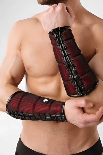 A red and black Maskulo-branded forearm guard wallet made of durable, smooth synthetic material with sturdy straps.