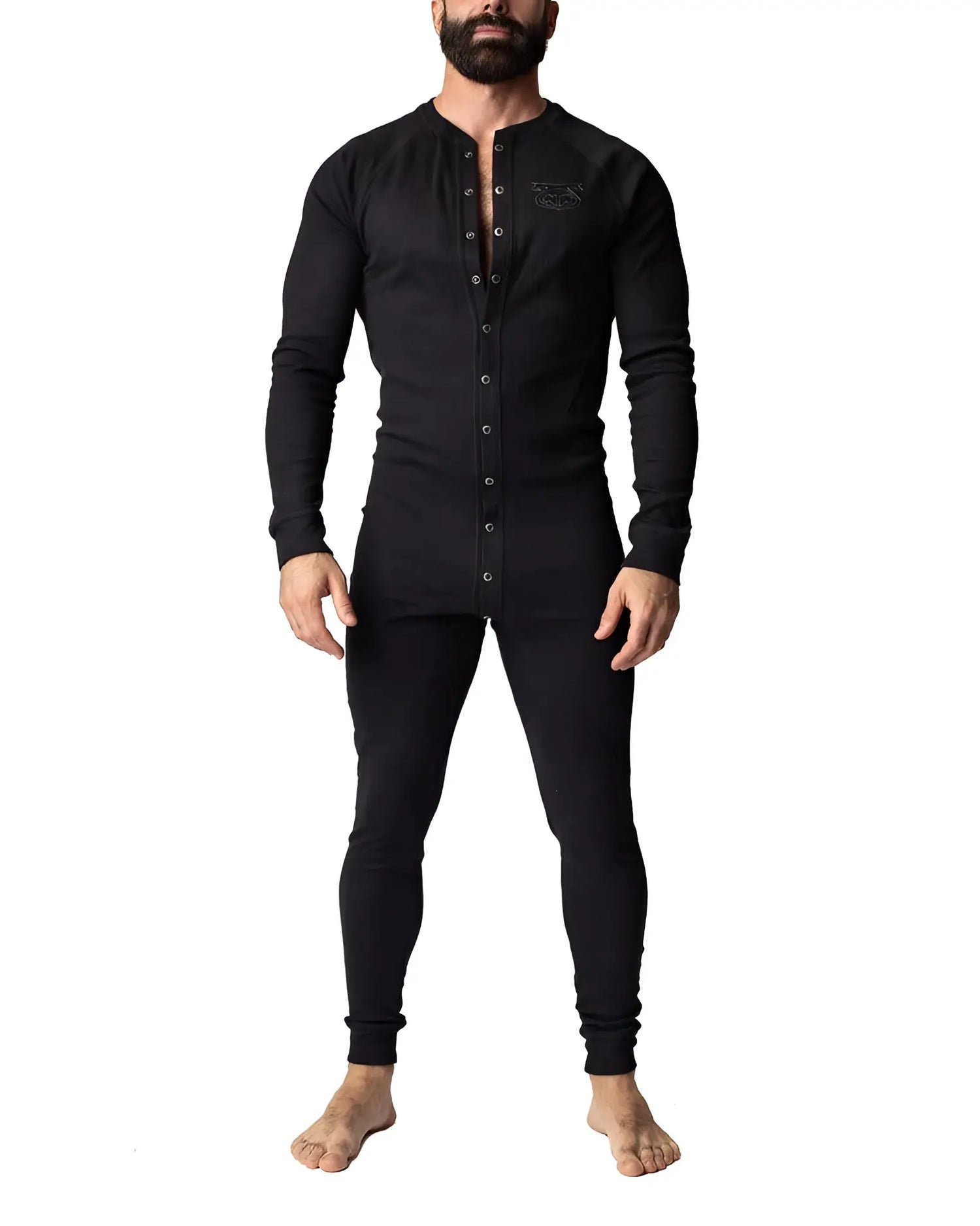 Man wearing Nasty Pig black thermal union suit with button-front Henley on white background