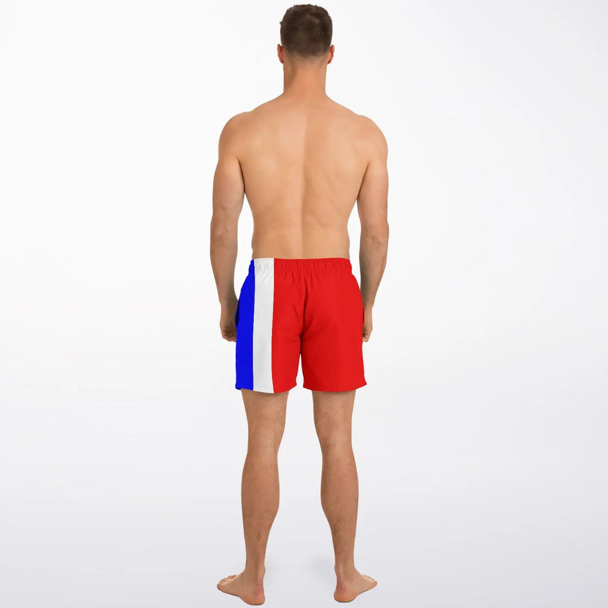 Men's swim shorts by Maris Equi in red blue and white with a color-block design shown on a model from the back.