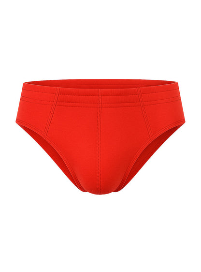 Bright red 100% cotton brief swim trunks with smooth stretchy fabric and subtle seam detailing