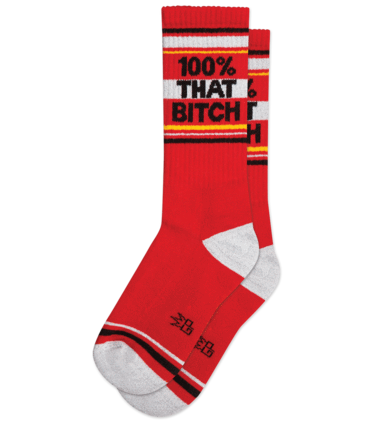 Red crew socks with white and black stripes featuring bold text 100% that bitch on the top section