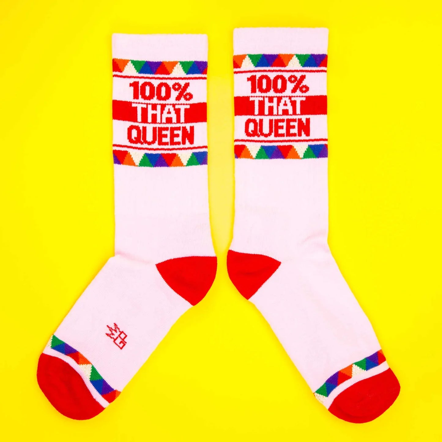 White 100 percent that queen crew socks with red toe and heel accents and colorful cuff patterns