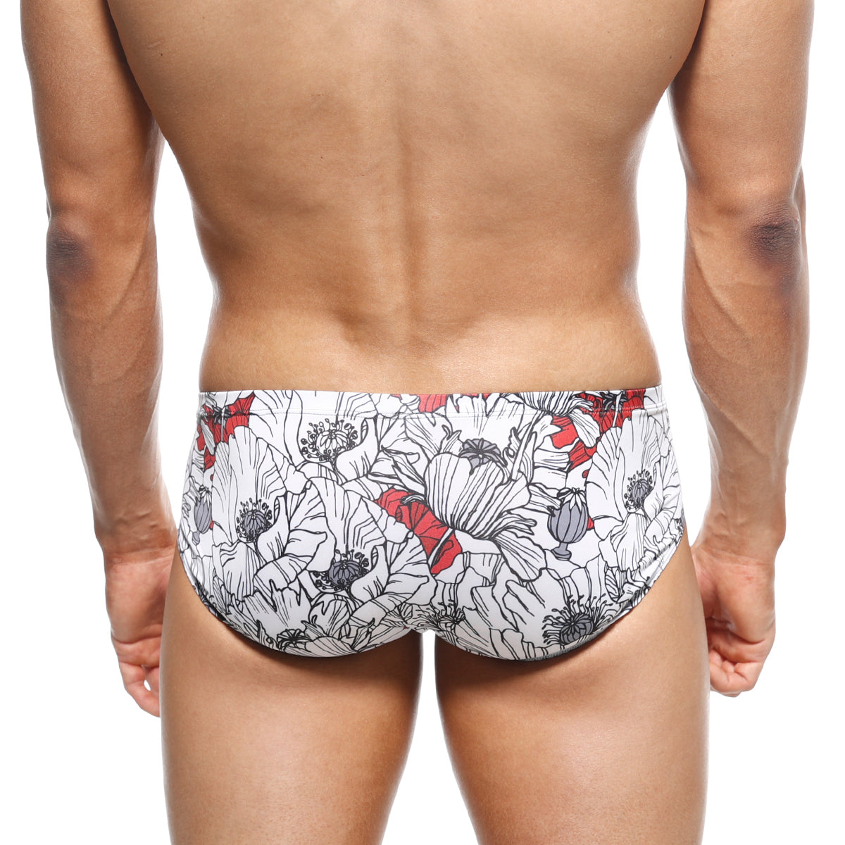 White swim trunks by metromalewear with bold black and red stylized poppy floral pattern for beachwear