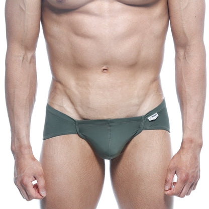 Dark green form-fitting swim trunks with sleek design and white brand tag on waistband metroMalewear mojito bikini 1006-26