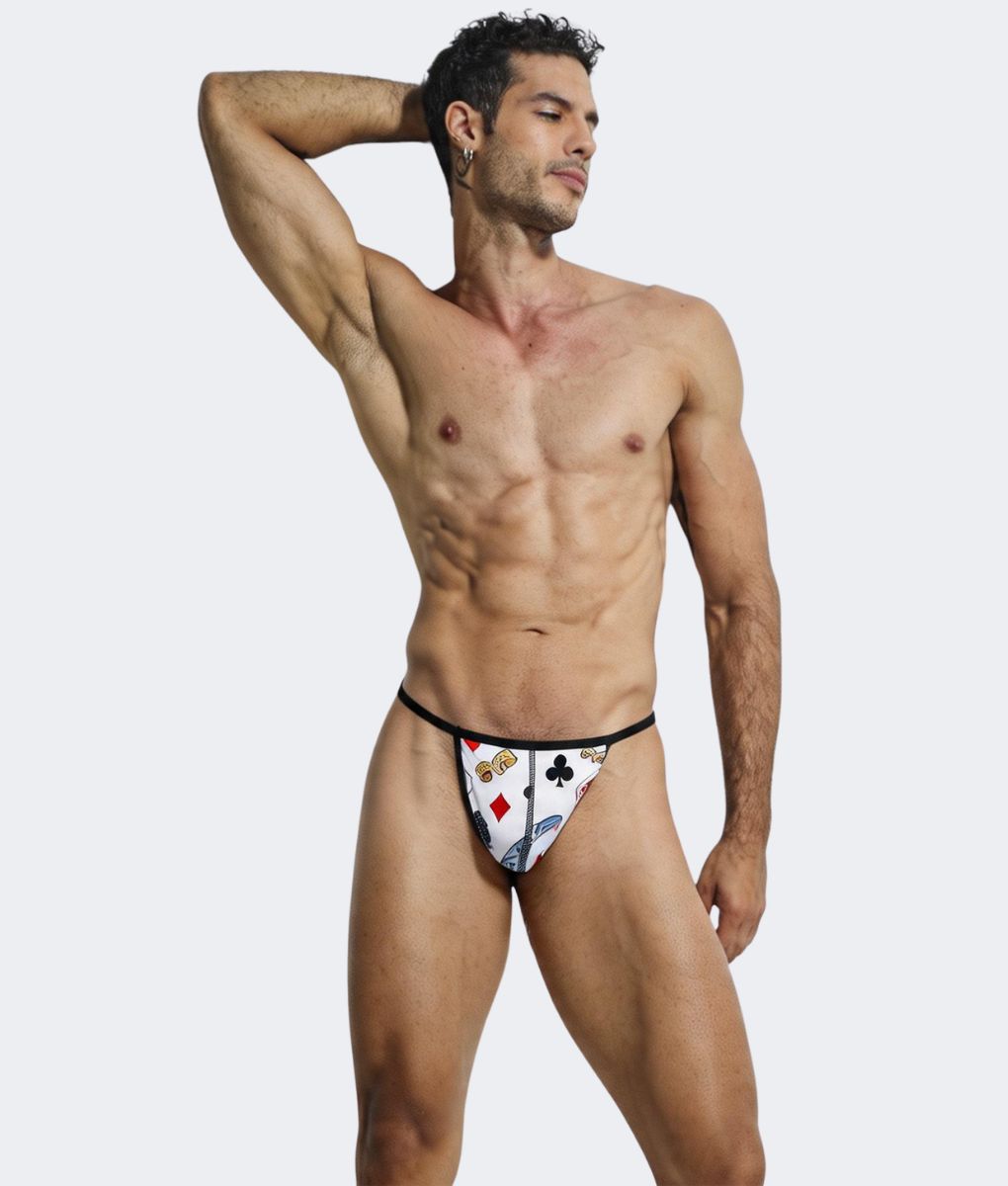 White hipster g-string thong with playing card print featuring red black and blue suits on a white background