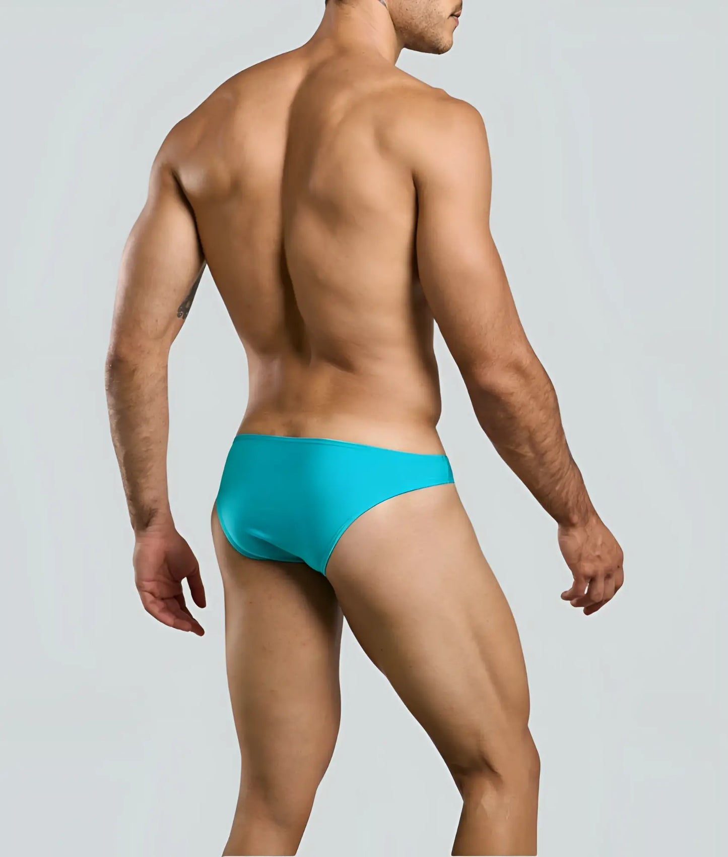 Turquoise swim trunks with a sleek form-fitting design from justin + simon classic mens bikini collection