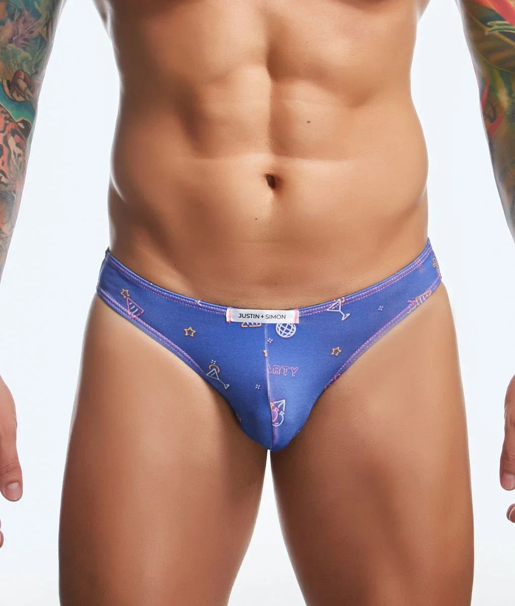 Blue justin simon classic mens bikini briefs with playful pink and white star cocktail glass patterns