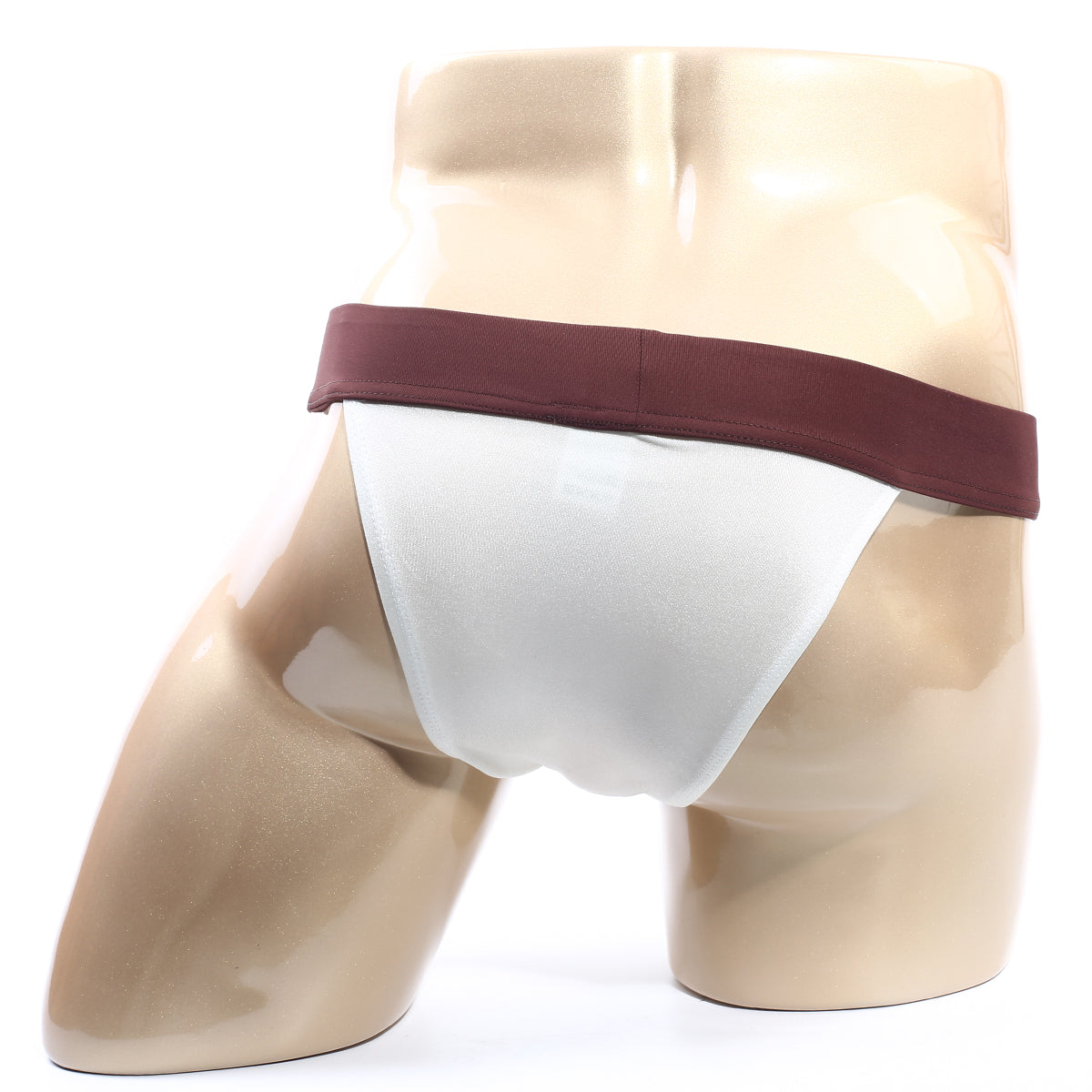 White MetroMaleWear Cosmos bikini briefs with maroon waistband displayed on a mannequin in cream fabric