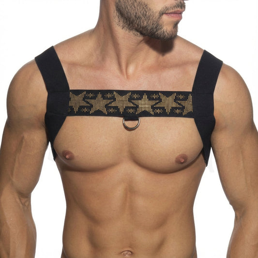 Black shoulder harness with gold embossed star pattern and central metal ring from metromalewear stars harness 1400-40